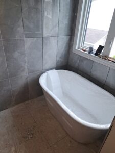 Ensuite bathroom renovation with freestanding tub and glass shower, Ottawa