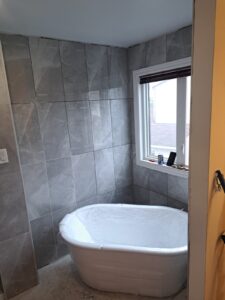 Ensuite bathroom renovation with freestanding tub and glass shower, Ottawa