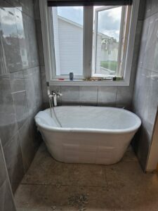 Ensuite bathroom renovation with freestanding tub and glass shower, Ottawa